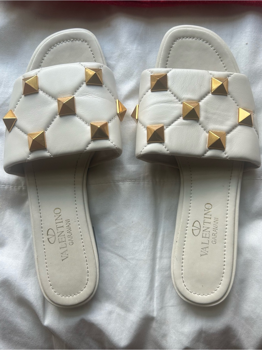 Valentino Garavani White Quilted Slide Sandals with Gold Pyramid Studs